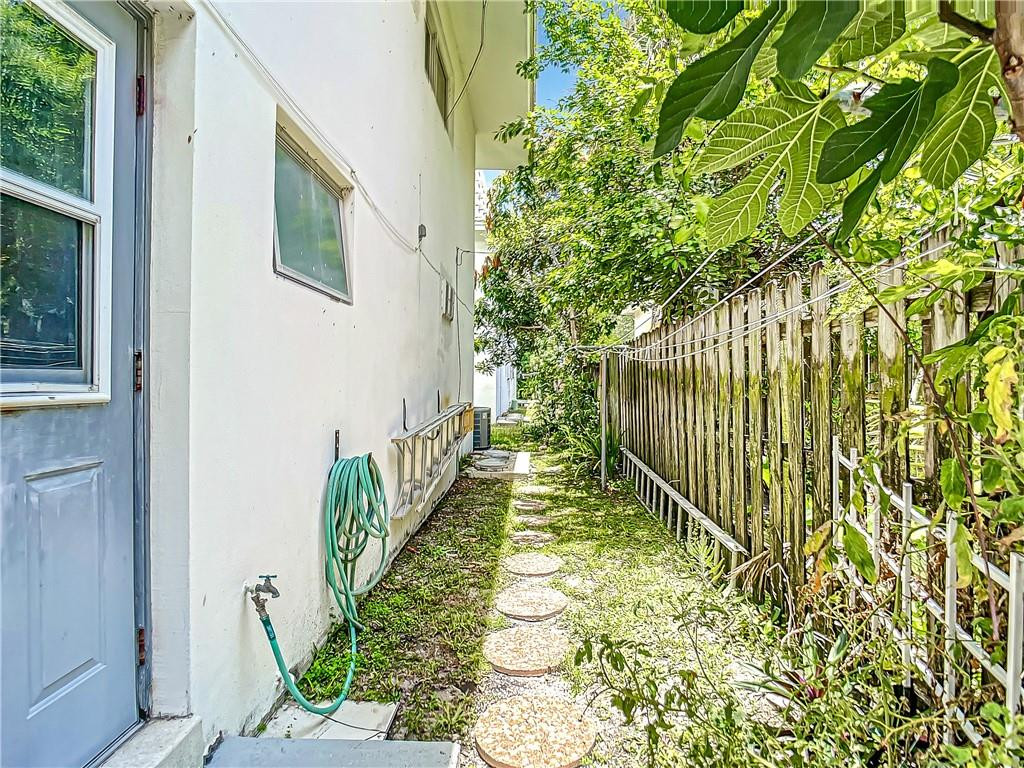 3208 Colony Club Road, Unit 2 Pompano Beach, FL 33062 - Photo 21 of 26 a view of a garden with pathway