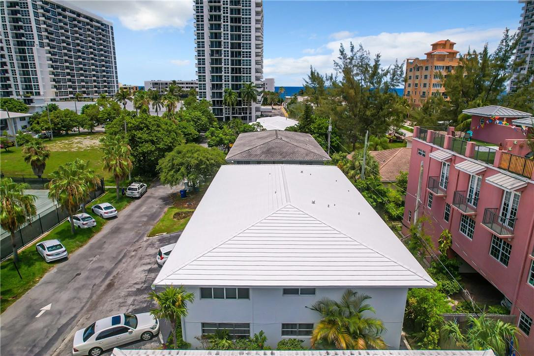 3208 Colony Club Road, Unit 2 Pompano Beach, FL 33062 - Photo 22 of 26 a view of a white building among the street