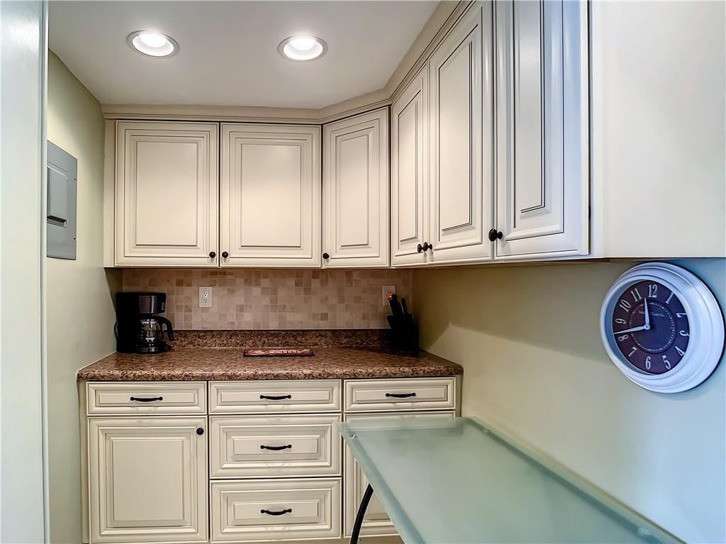3208 Colony Club Road, Unit 2 Pompano Beach, FL 33062 - Photo 4 of 26 a view of cabinets and wooden floor