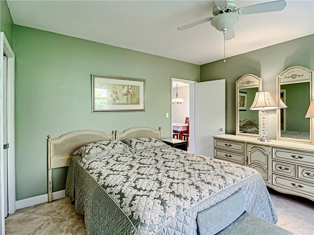 3208 Colony Club Road, Unit 2 Pompano Beach, FL 33062 - Photo 10 of 26 a bedroom with a bed and a dresser