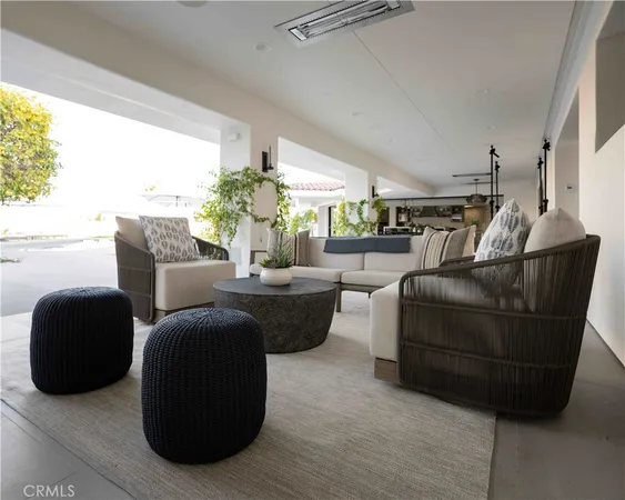 a room with a table chairs and entryway