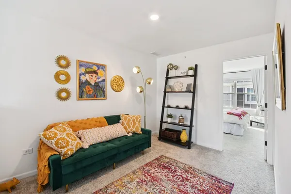 a bedroom with a bed and a couch