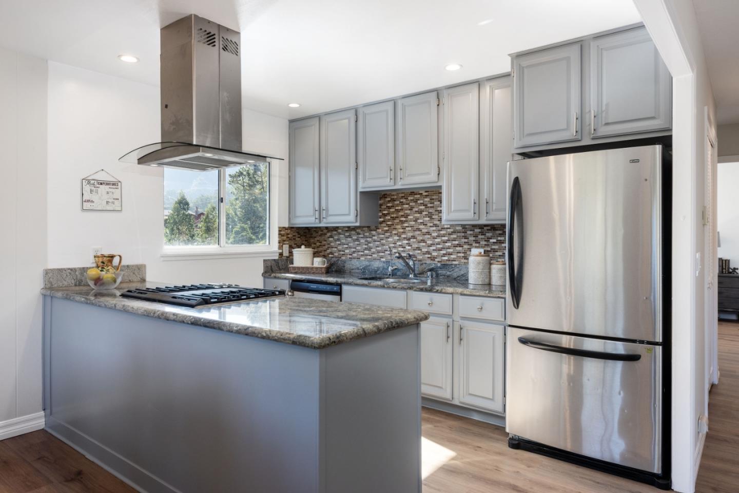 1155 Banyan Way Pacifica, CA 94044 - Photo 12 of 45 a kitchen with stainless steel appliances granite countertop a refrigerator sink and cabinets