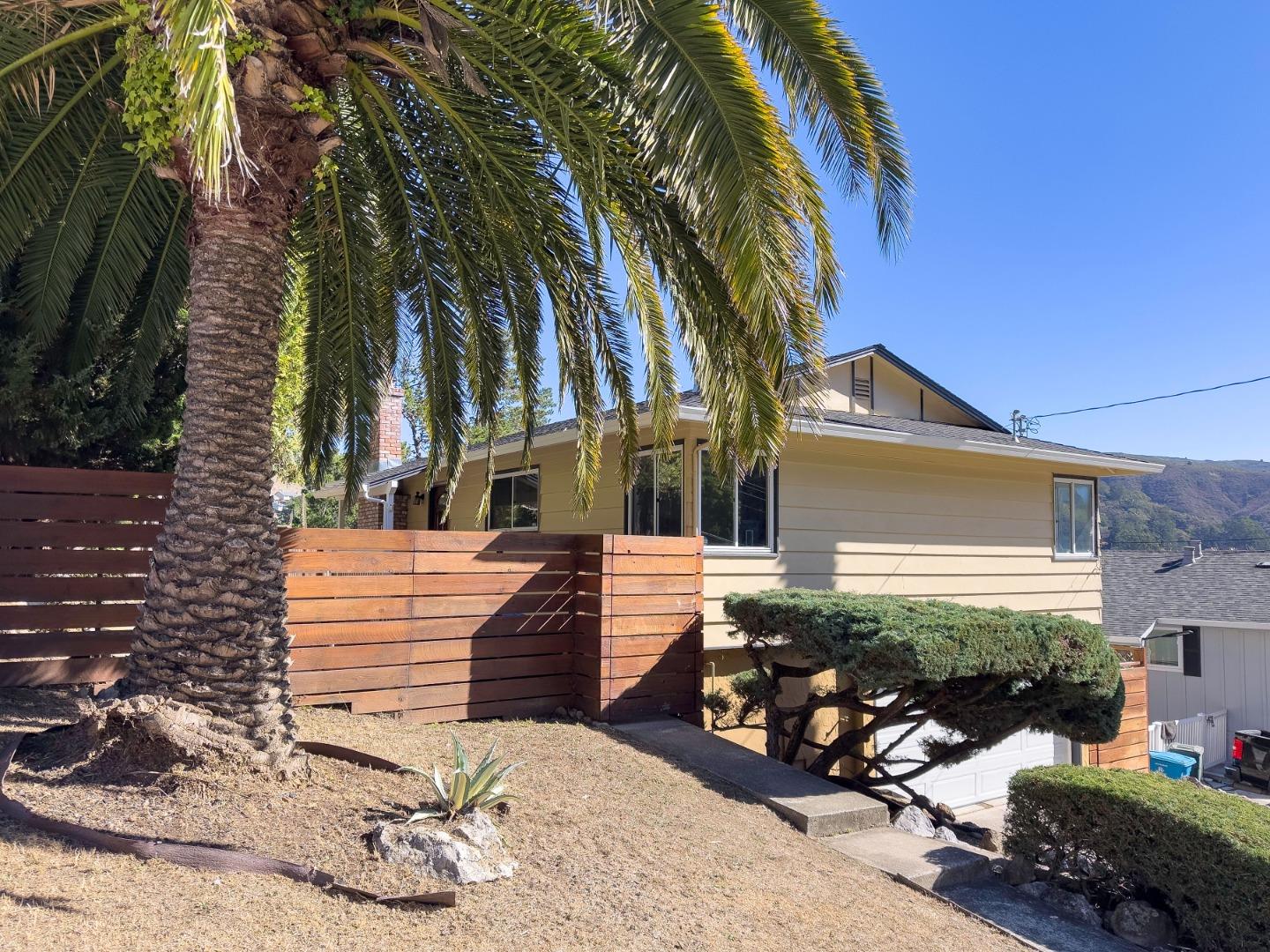 1155 Banyan Way Pacifica, CA 94044 - Photo 2 of 45 a view of a house with a yard