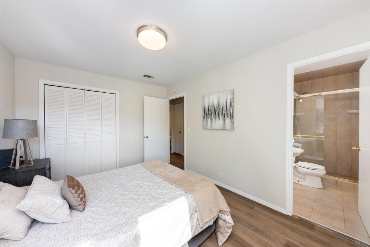 1155 Banyan Way Pacifica, CA 94044 - Photo 21 of 45 a bedroom with a bed and a view of bathroom