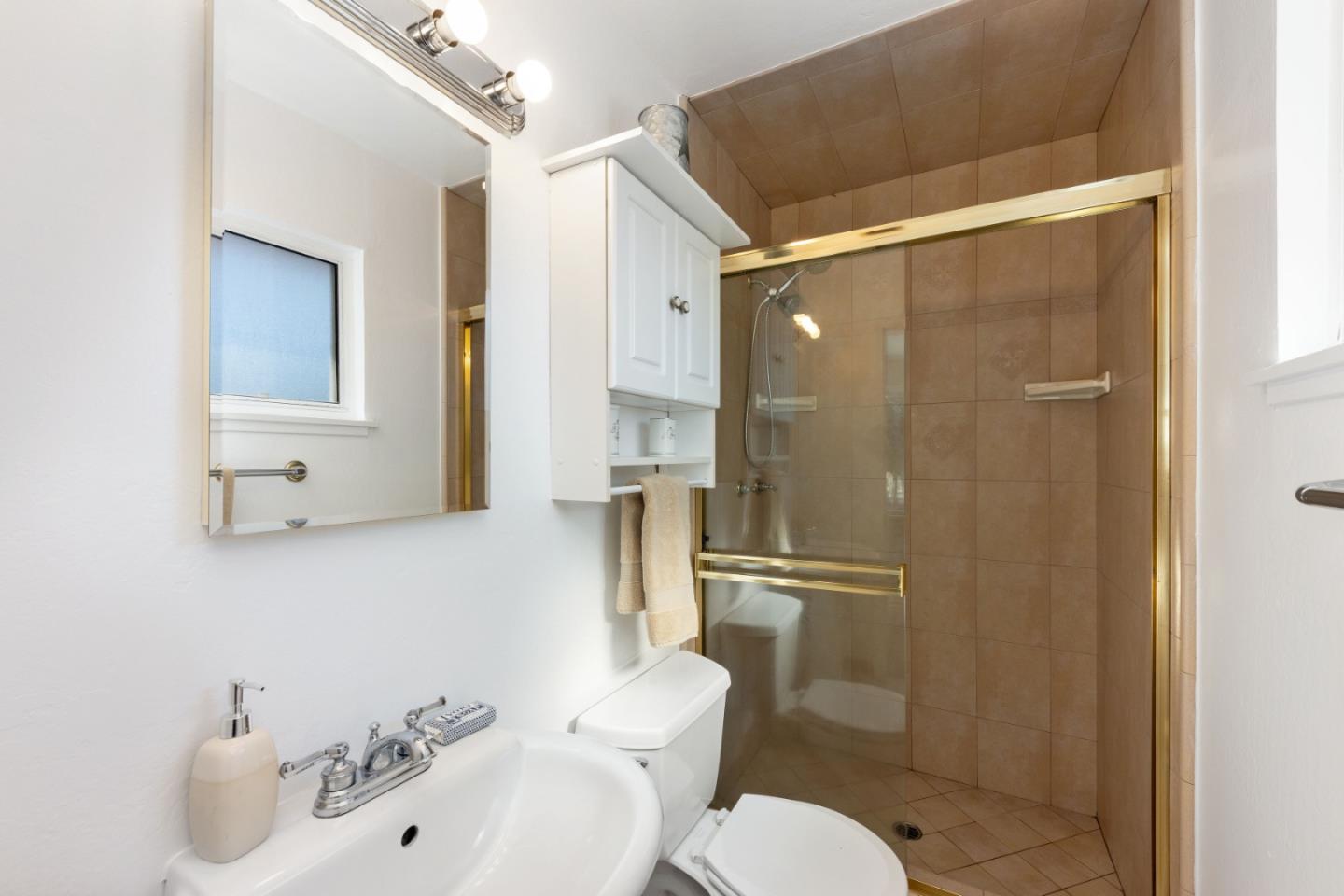 1155 Banyan Way Pacifica, CA 94044 - Photo 22 of 45 a bathroom with a sink toilet and shower