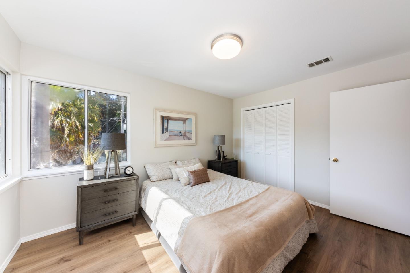 1155 Banyan Way Pacifica, CA 94044 - Photo 23 of 45 a bedroom with a large bed and a window