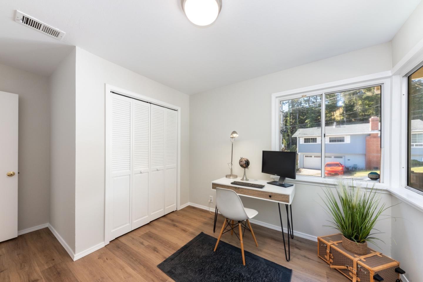 1155 Banyan Way Pacifica, CA 94044 - Photo 25 of 45 a workspace with furniture and a window
