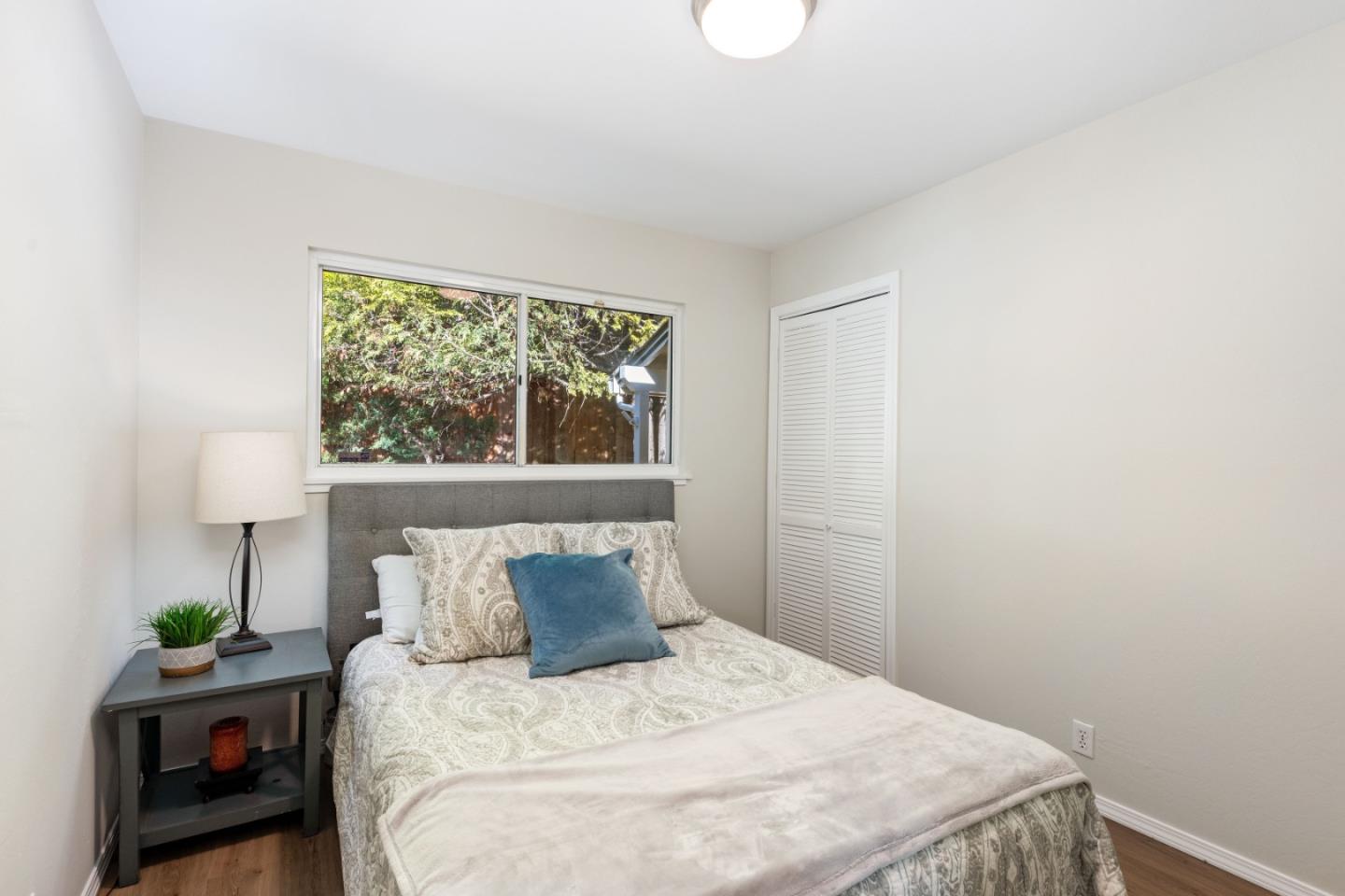 1155 Banyan Way Pacifica, CA 94044 - Photo 26 of 45 a bedroom with a bed and a window