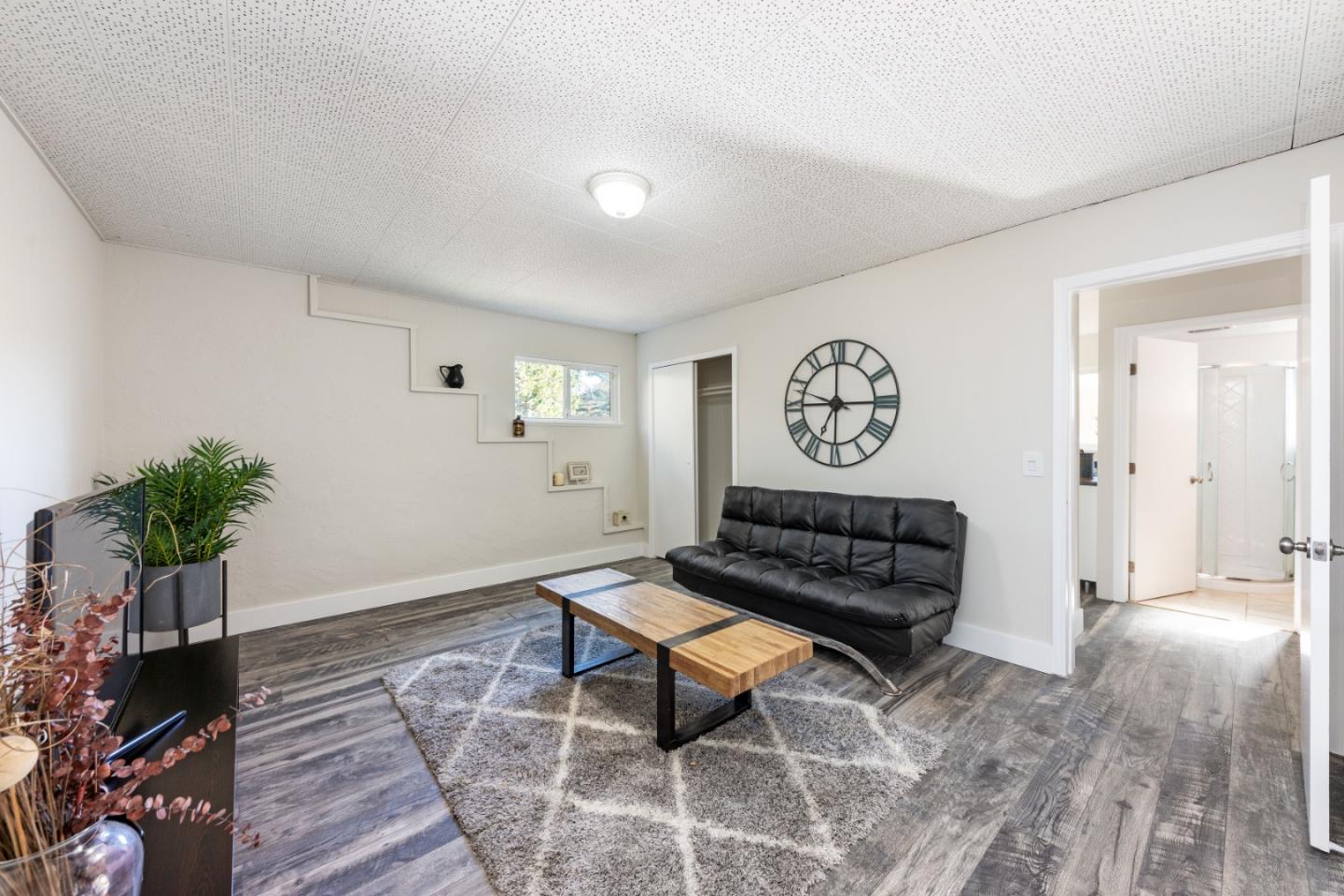 1155 Banyan Way Pacifica, CA 94044 - Photo 28 of 45 a living room with furniture and a potted plant