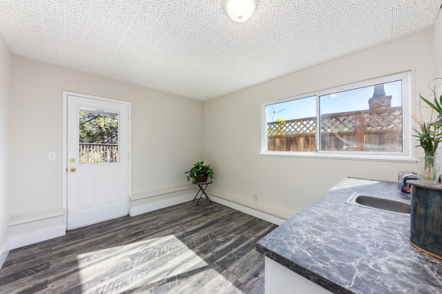 1155 Banyan Way Pacifica, CA 94044 - Photo 30 of 45 a living room with wooden floor and window