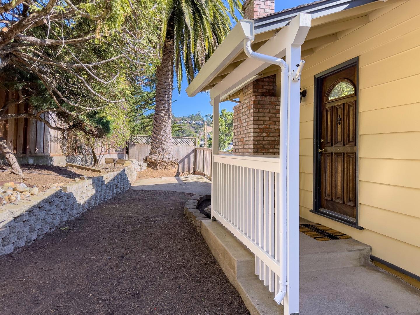 1155 Banyan Way Pacifica, CA 94044 - Photo 3 of 45 a view of a house with a yard