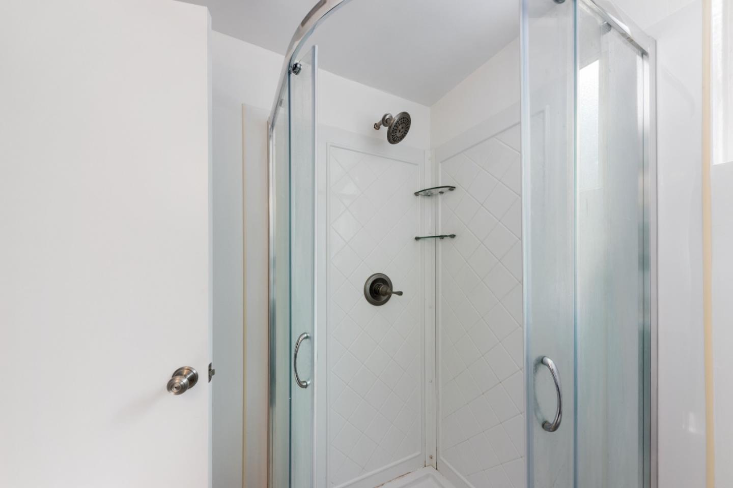 1155 Banyan Way Pacifica, CA 94044 - Photo 33 of 45 a bathroom with a glass shower door