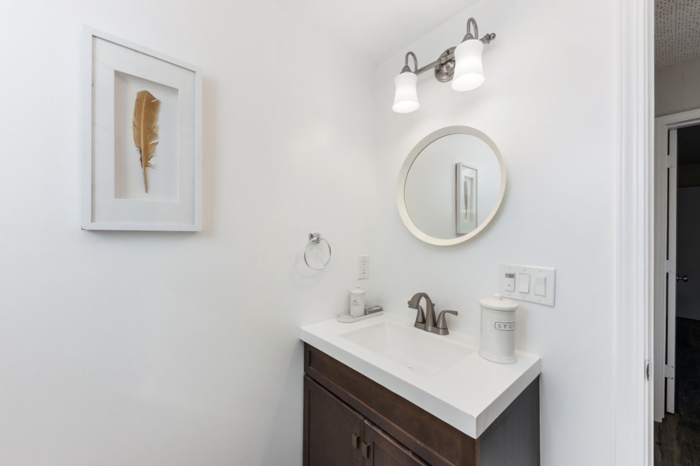1155 Banyan Way Pacifica, CA 94044 - Photo 34 of 45 a bathroom with a sink and a mirror