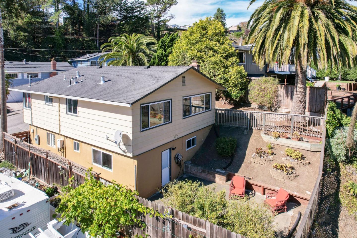 1155 Banyan Way Pacifica, CA 94044 - Photo 45 of 45 an aerial view of a house with a yard and potted plants