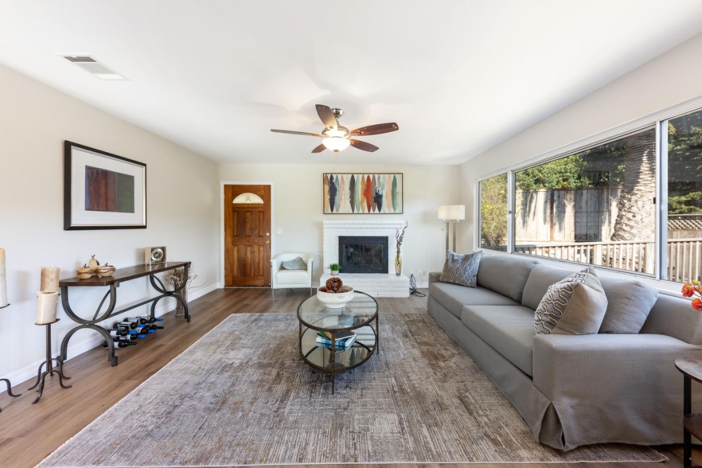 1155 Banyan Way Pacifica, CA 94044 - Photo 5 of 45 a living room with furniture two window and a fireplace
