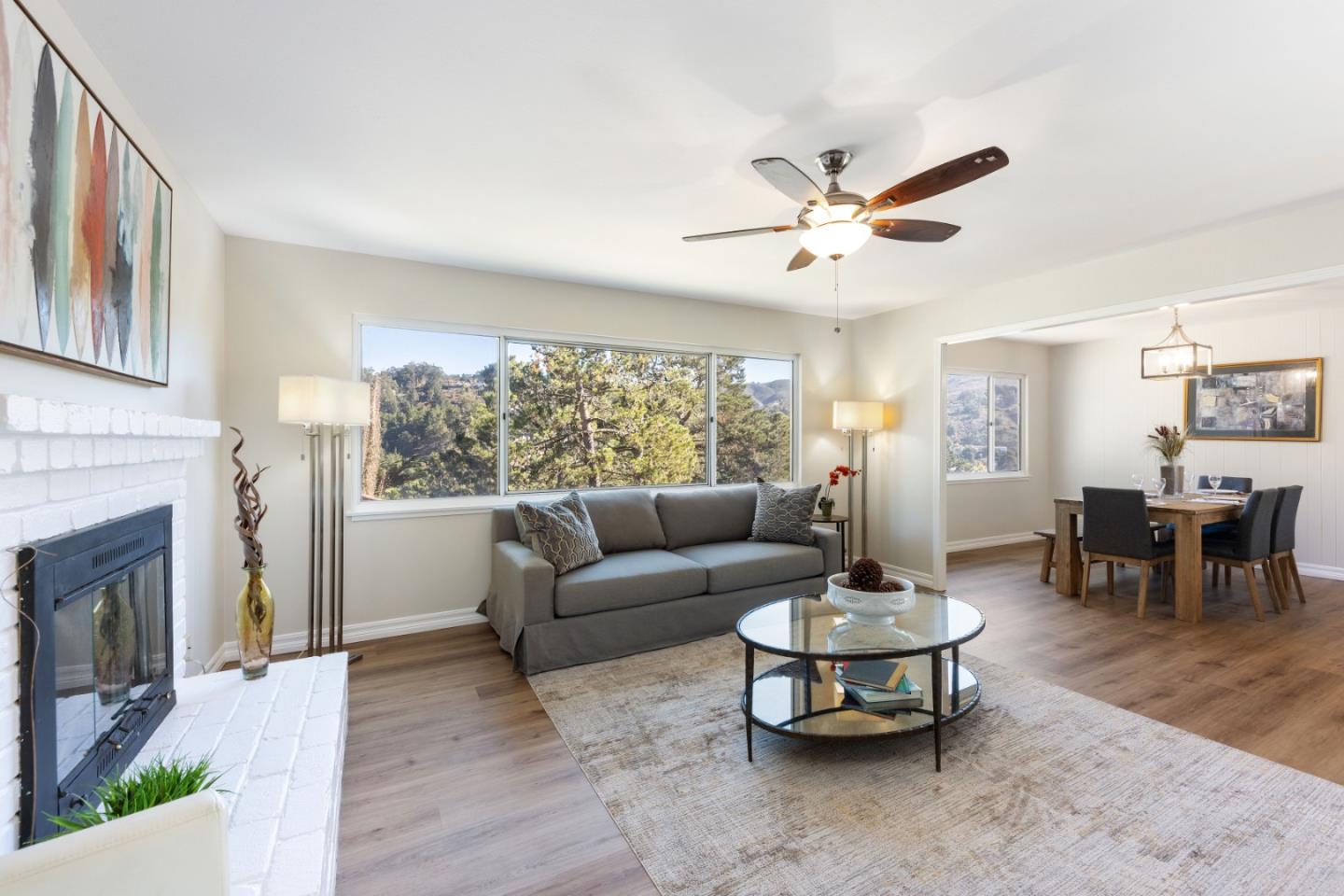 1155 Banyan Way Pacifica, CA 94044 - Photo 6 of 45 a living room with furniture a fireplace and a table