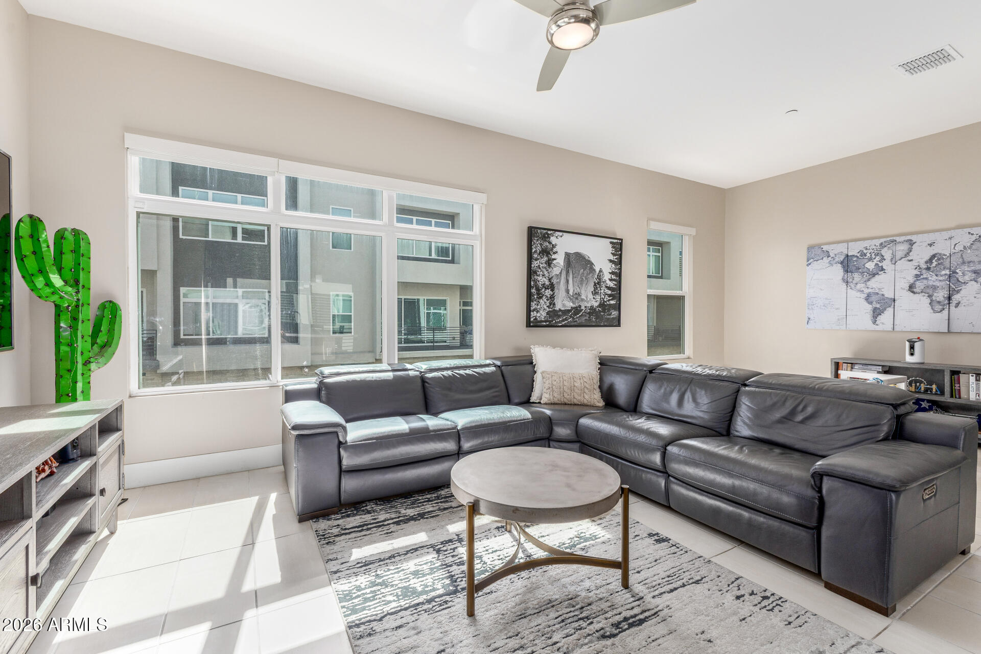 6850 East McDowell Road, Unit 71 Scottsdale, AZ 85257 - Photo 12 of 36 a living room with furniture and a large window