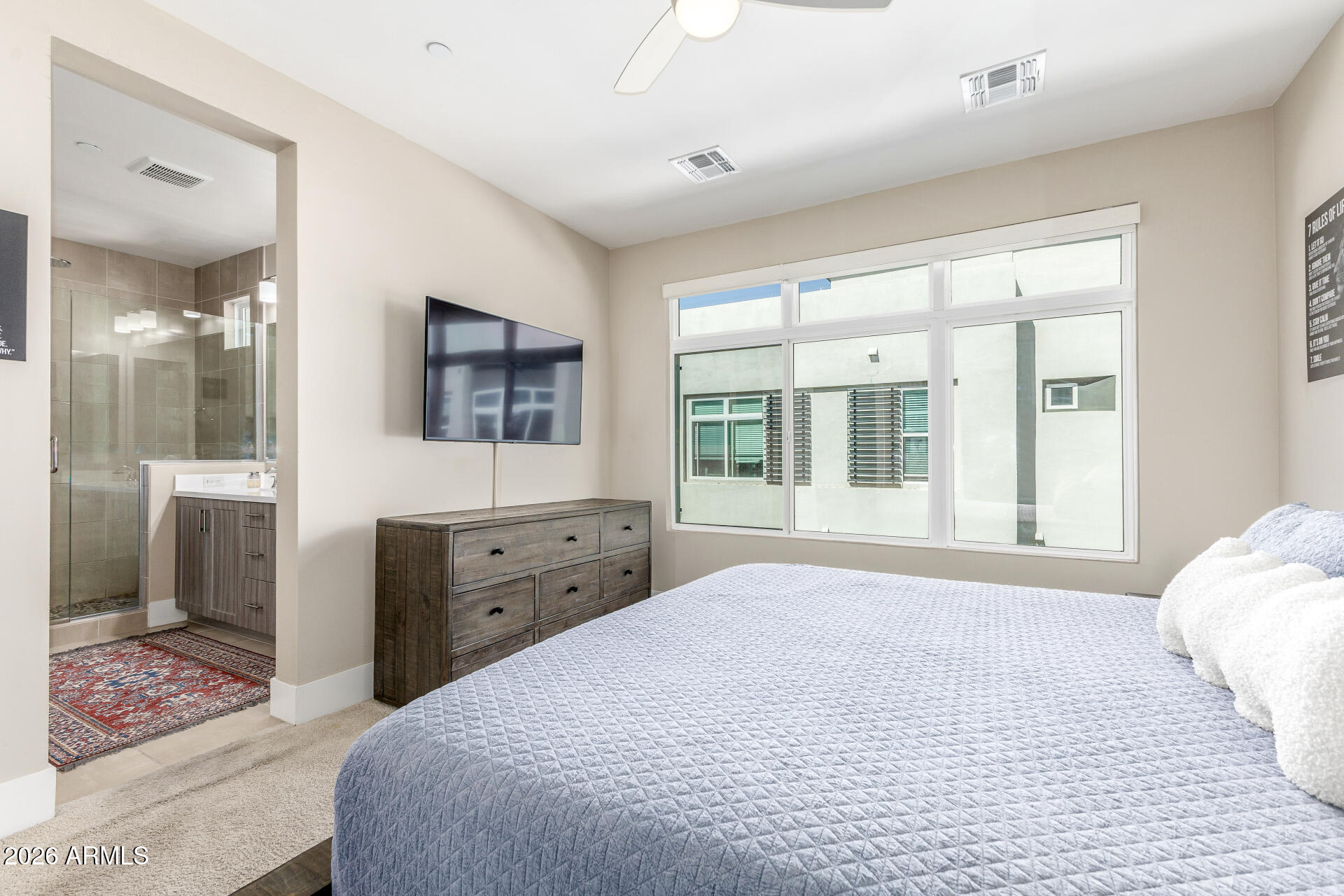 6850 East McDowell Road, Unit 71 Scottsdale, AZ 85257 - Photo 16 of 36 a bedroom with a large bed and a window