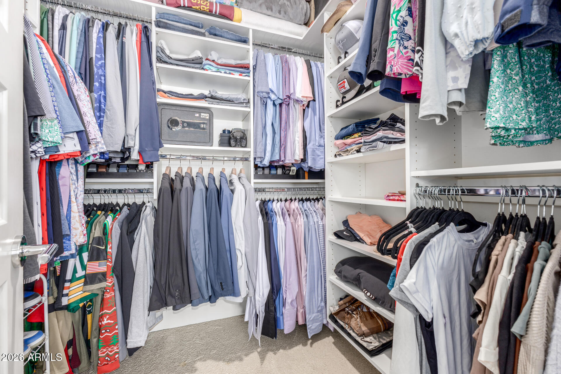 6850 East McDowell Road, Unit 71 Scottsdale, AZ 85257 - Photo 18 of 36 a view of walk in closet with clothes