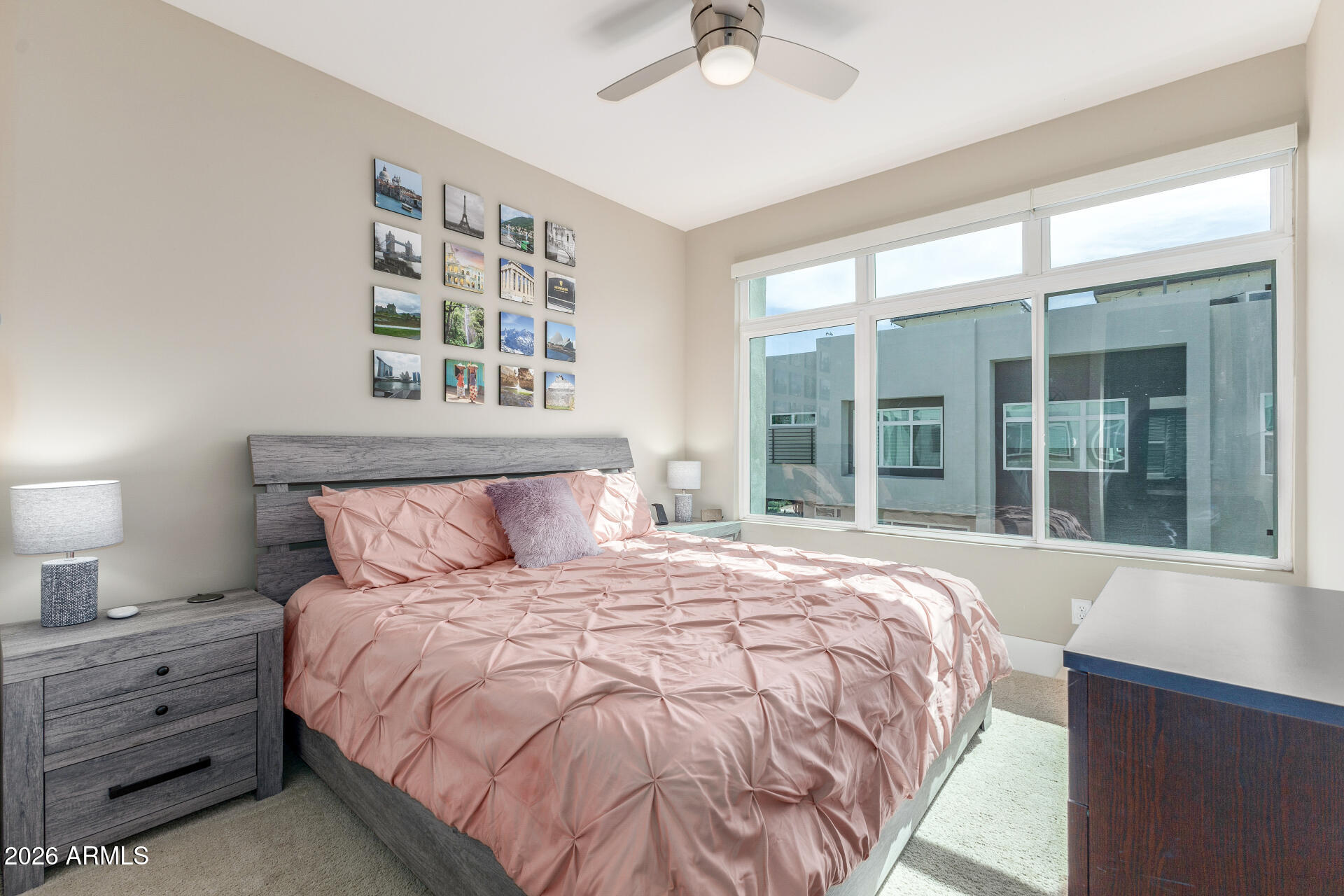 6850 East McDowell Road, Unit 71 Scottsdale, AZ 85257 - Photo 19 of 36 a large bed sitting in a bedroom next to a window
