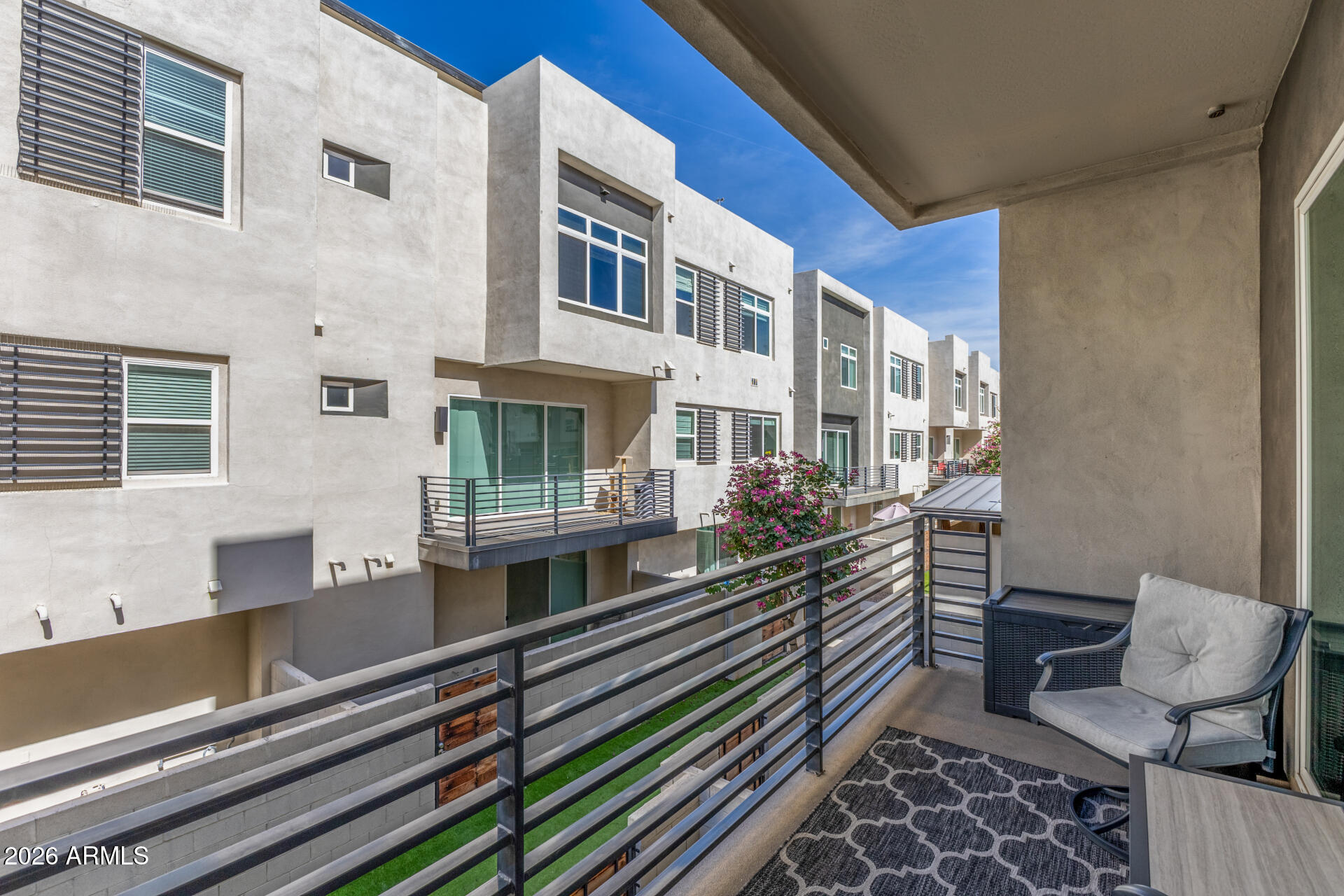 6850 East McDowell Road, Unit 71 Scottsdale, AZ 85257 - Photo 27 of 36 a view of a building with many windows