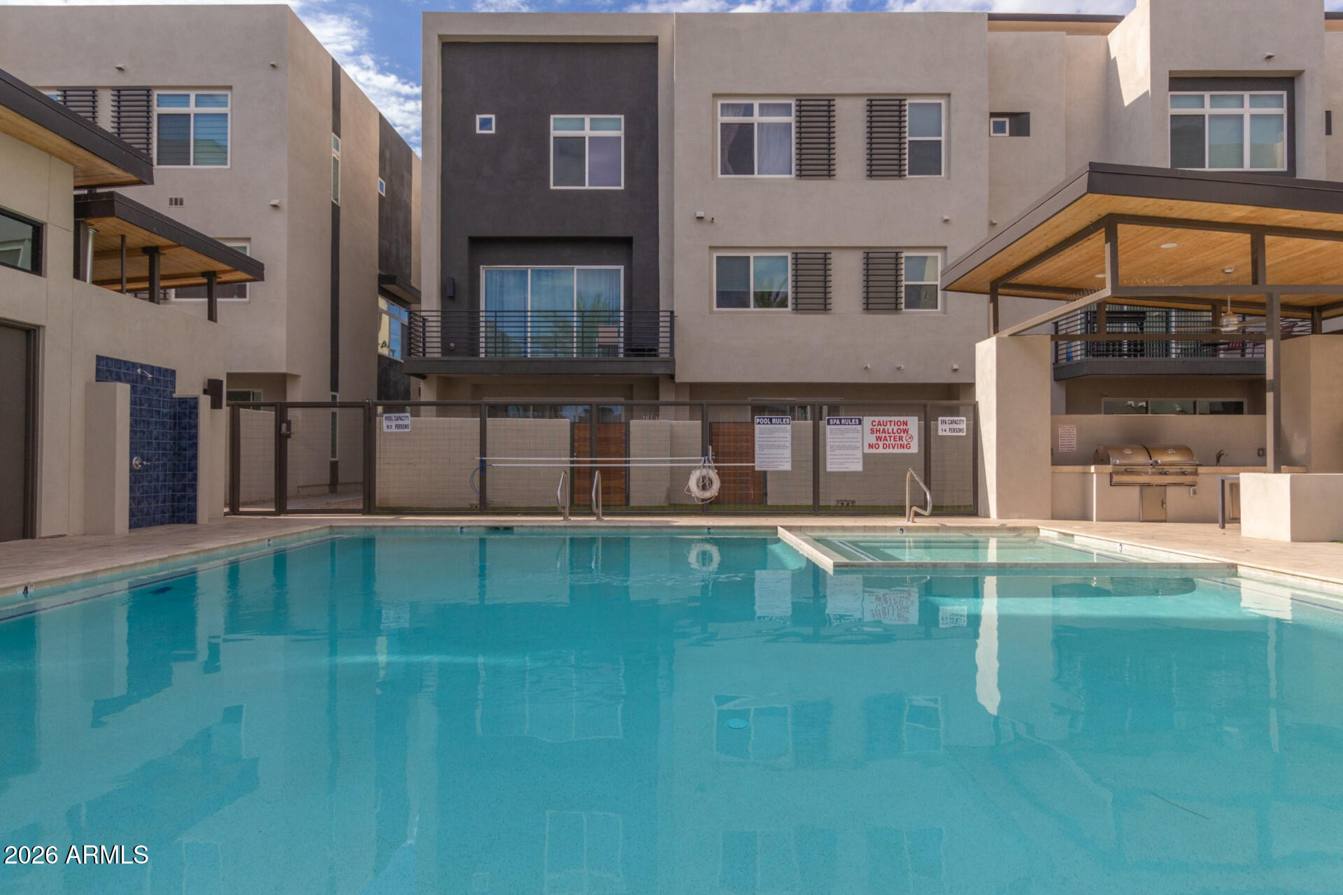 6850 East McDowell Road, Unit 71 Scottsdale, AZ 85257 - Photo 31 of 36 a view of a building with a swimming pool
