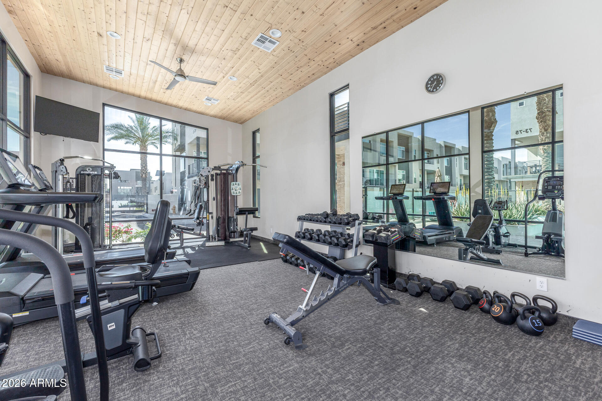 6850 East McDowell Road, Unit 71 Scottsdale, AZ 85257 - Photo 34 of 36 a living room with furniture and a floor to ceiling window