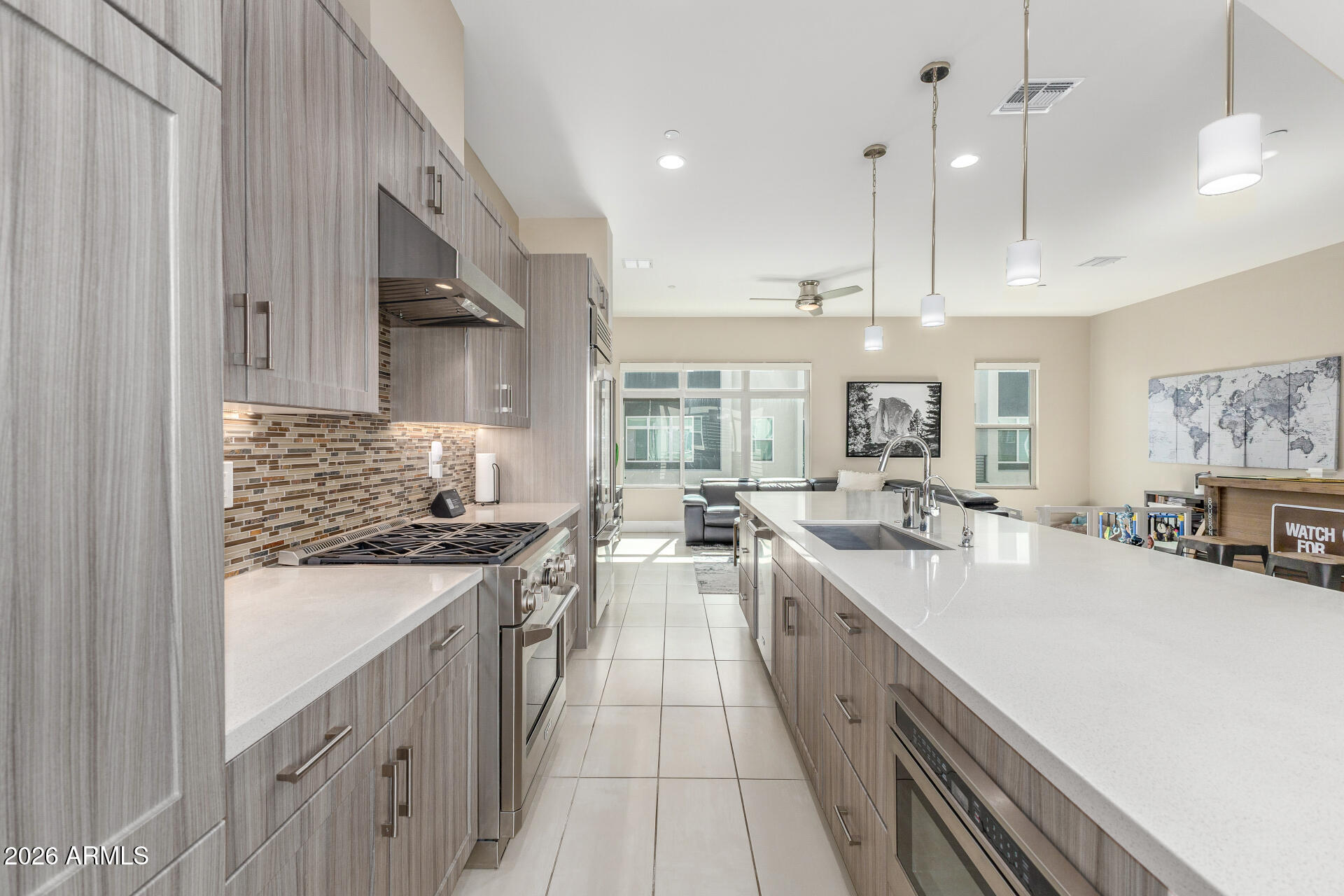 6850 East McDowell Road, Unit 71 Scottsdale, AZ 85257 - Photo 8 of 36 a large kitchen with stainless steel appliances lots of counter space and a sink