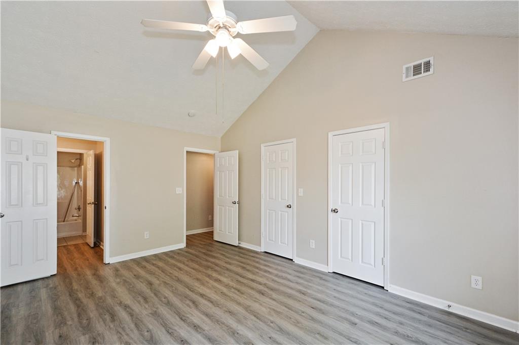 Undisclosed Address Conyers, GA 30013 - Photo 16 of 24 a view of an empty room with wooden floor