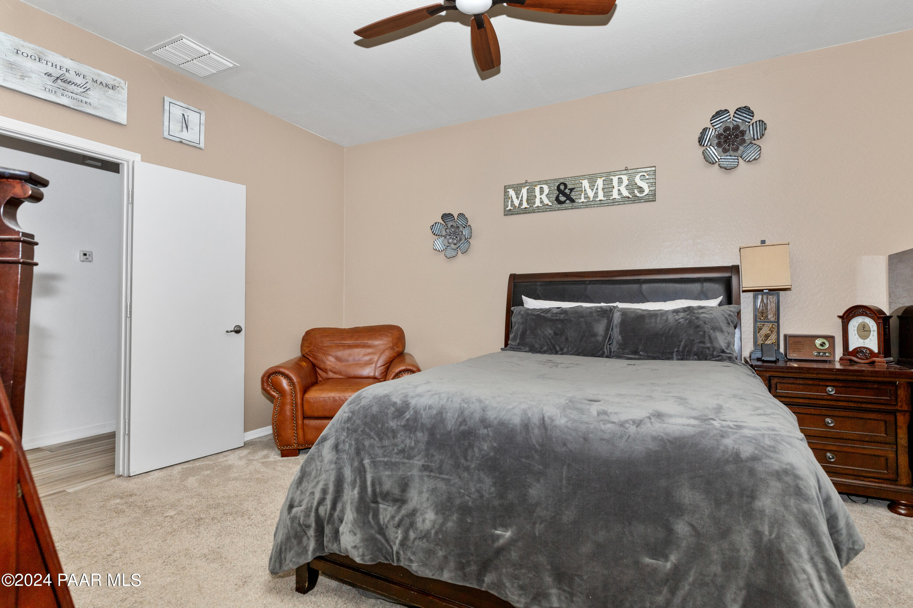 7753 Melody Ranch Road Prescott Valley, AZ 86315 - Photo 11 of 42 a bedroom with a bed and dresser