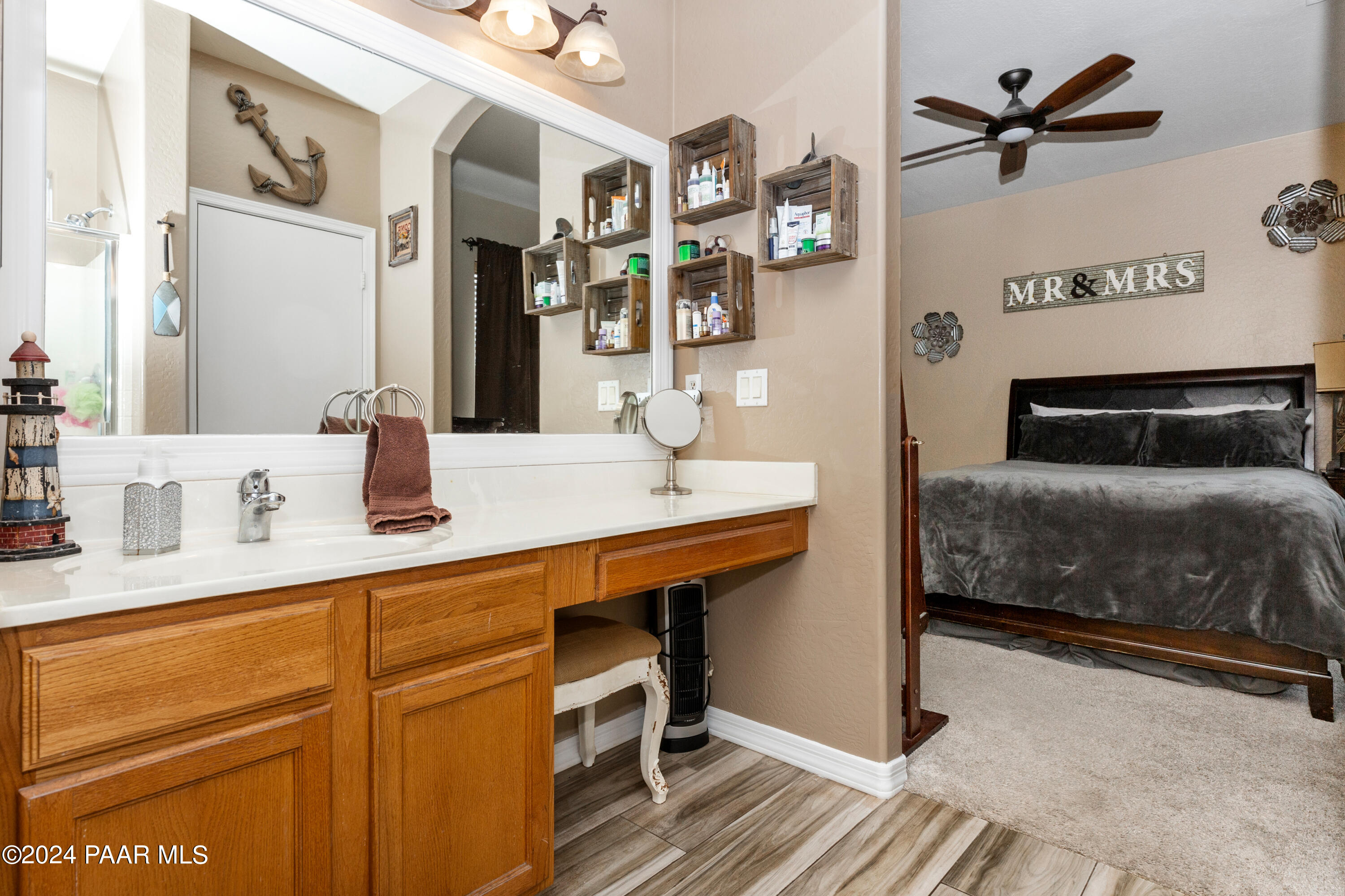 7753 Melody Ranch Road Prescott Valley, AZ 86315 - Photo 13 of 42 a en suite bathroom with a sink double vanity and a mirror