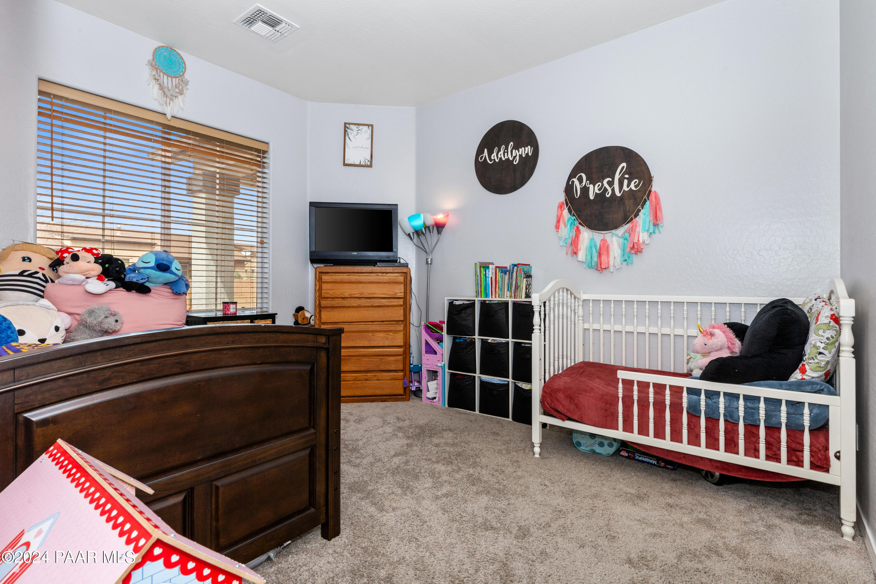 7753 Melody Ranch Road Prescott Valley, AZ 86315 - Photo 15 of 42 a living room with furniture and a flat screen tv