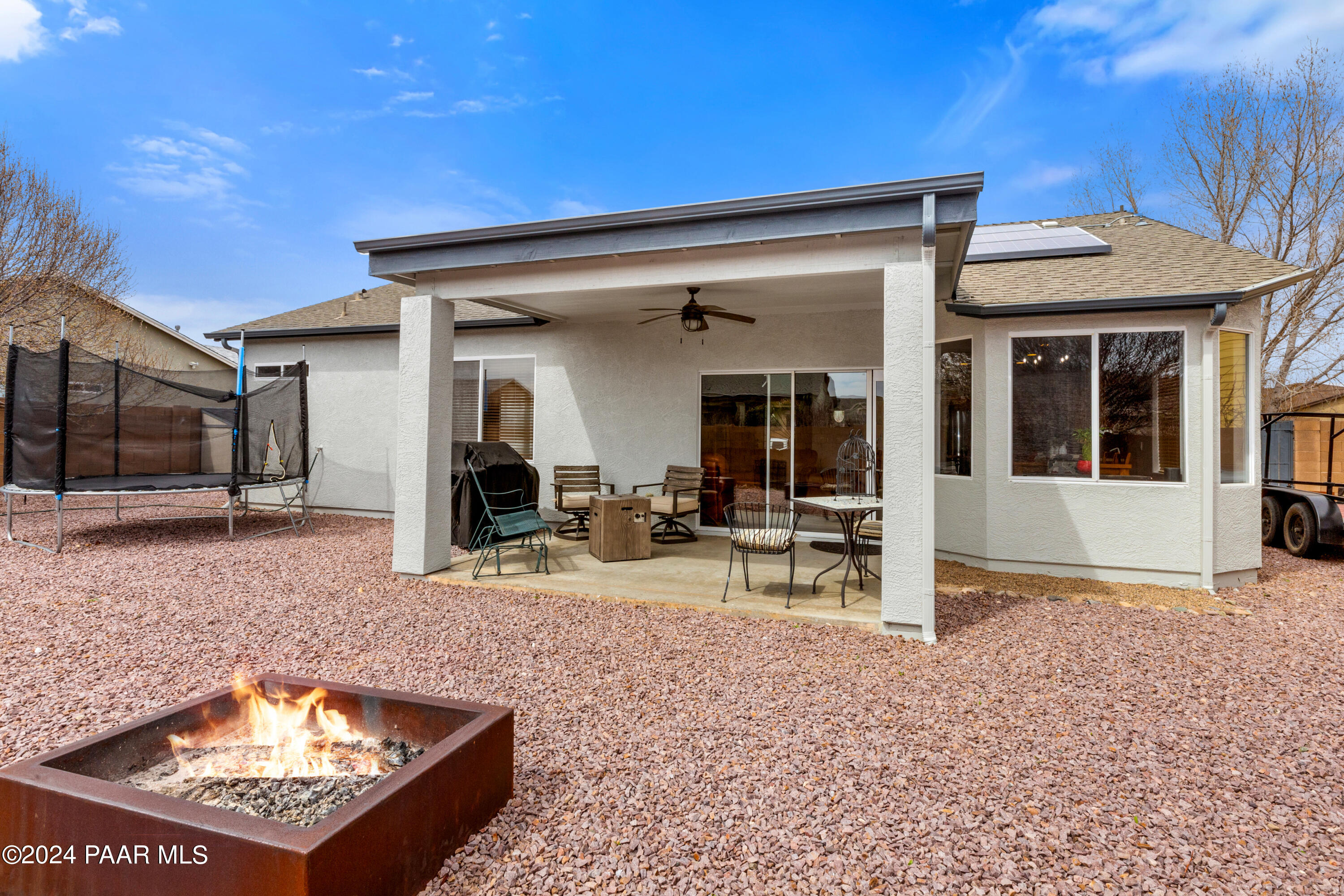 7753 Melody Ranch Road Prescott Valley, AZ 86315 - Photo 25 of 42 a view of a house with backyard porch and sitting area
