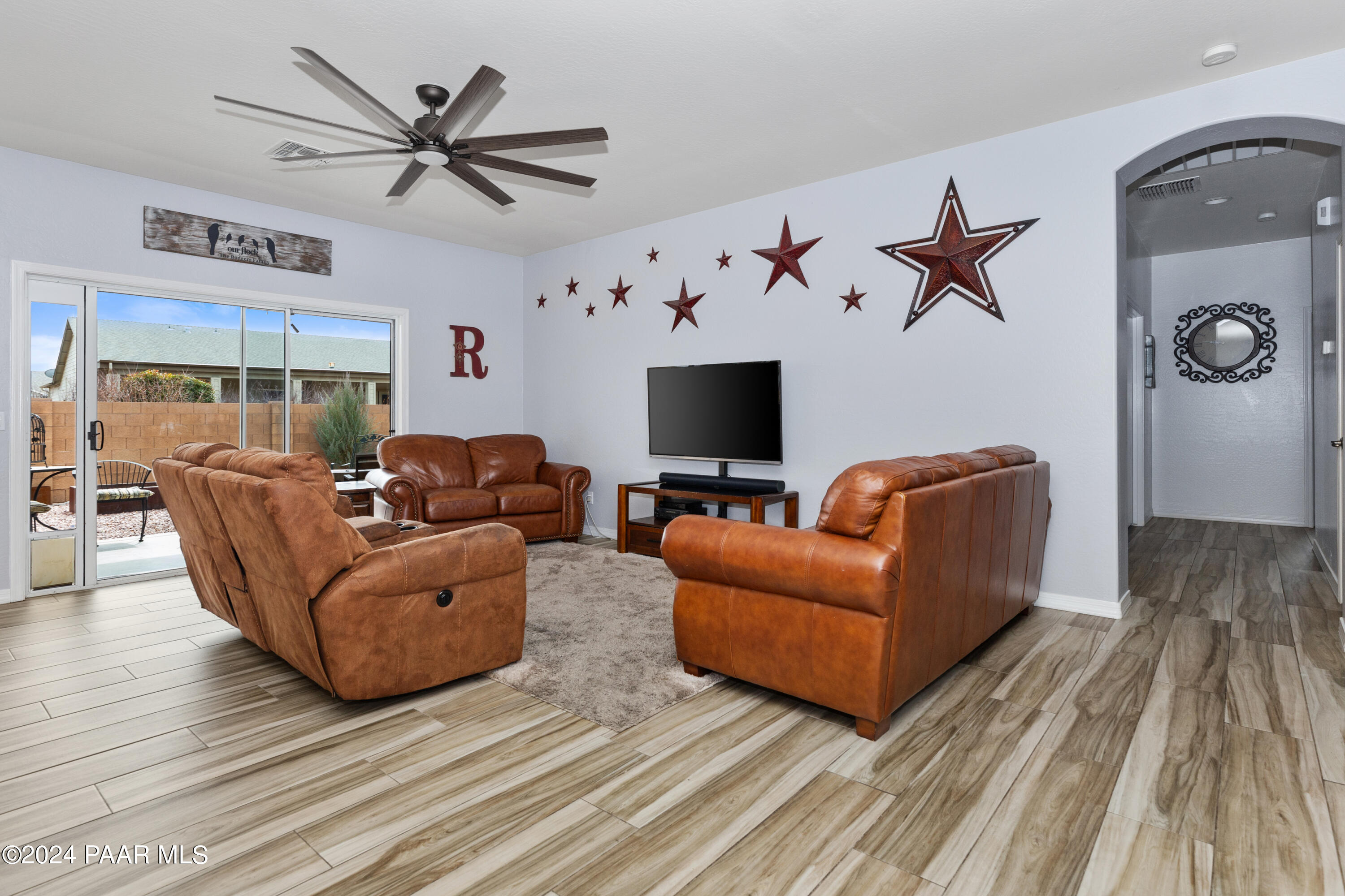 7753 Melody Ranch Road Prescott Valley, AZ 86315 - Photo 3 of 42 a living room with furniture and a wooden floor