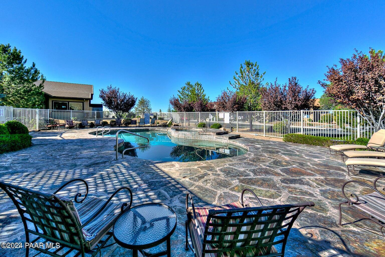 7753 Melody Ranch Road Prescott Valley, AZ 86315 - Photo 35 of 42 a view of a swimming pool with a patio