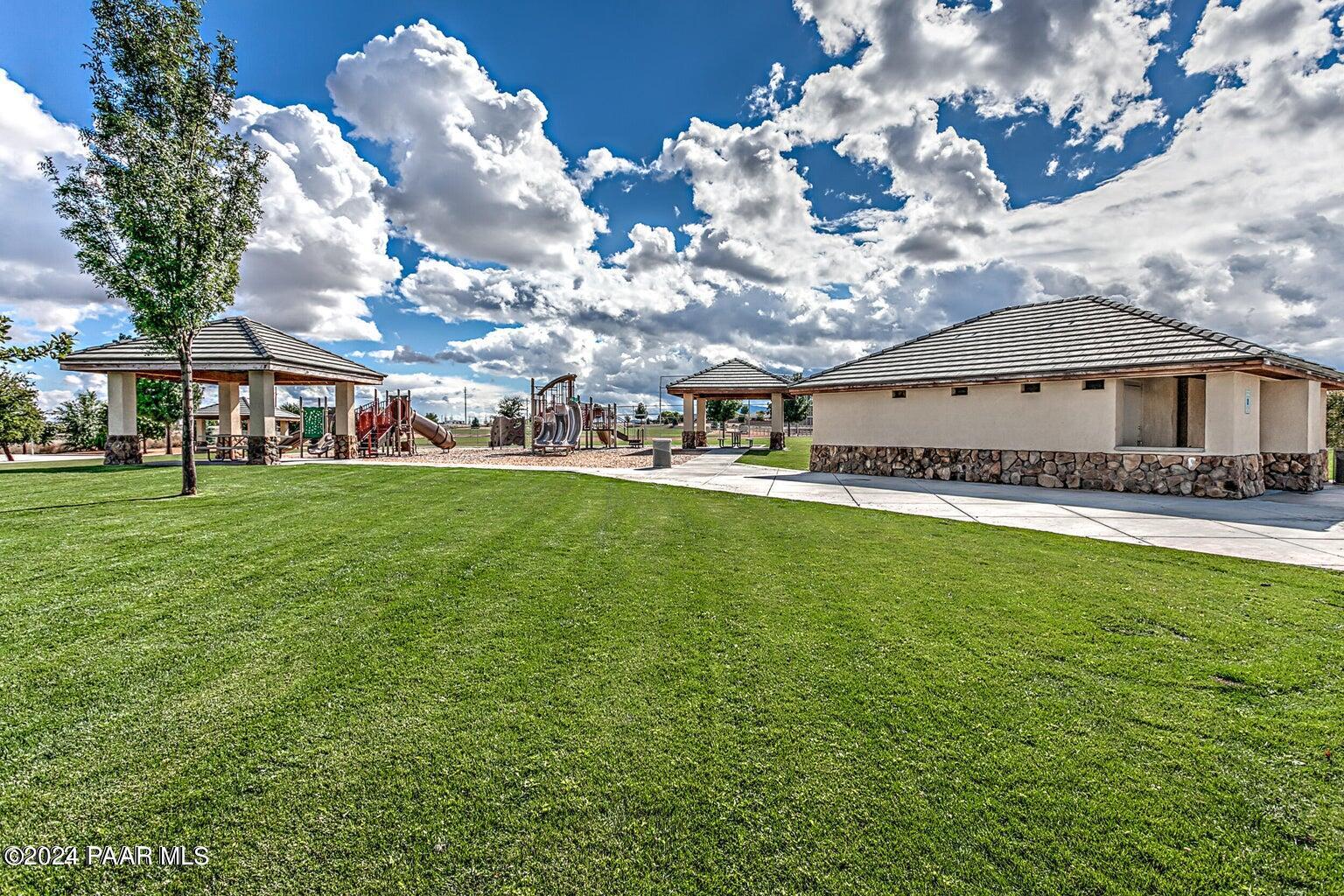 7753 Melody Ranch Road Prescott Valley, AZ 86315 - Photo 41 of 42 a view of a house with a big yard