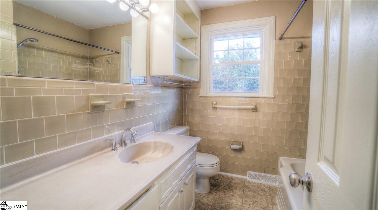 2305 East Lee Road Taylors, SC 29687 - Photo 15 of 27 Built in hamper and shelves, tub/shower combo & new faucet