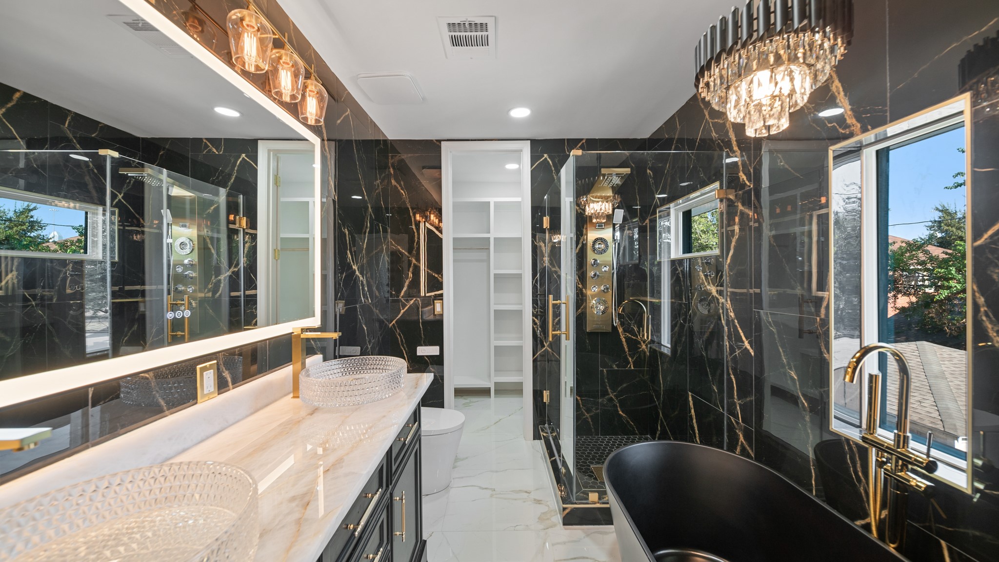 2119 Isabella Street Houston, TX 77004 - Photo 17 of 23 a bathroom with double vanity and a shower