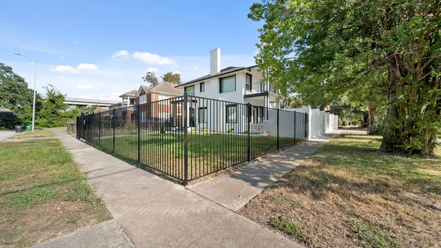 a view of a house with a yard and garage