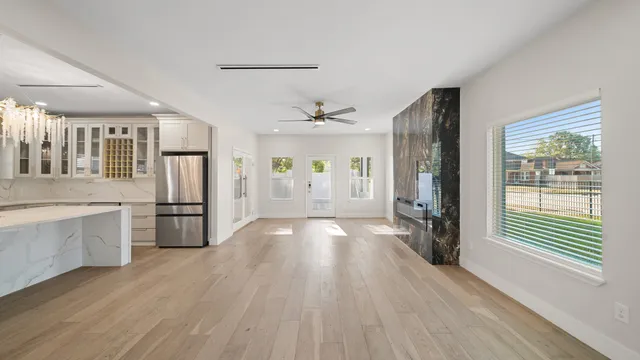 a view of a electric appliances and windows in a room