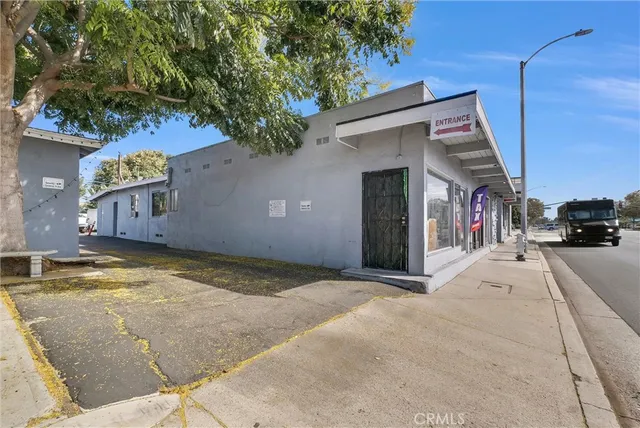 a view of a car park in front of a house