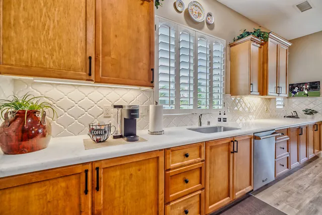 a view of a dining room with furniture and a chandelier