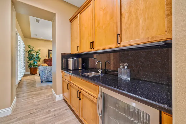 a kitchen with stainless steel appliances granite countertop a sink and a stove
