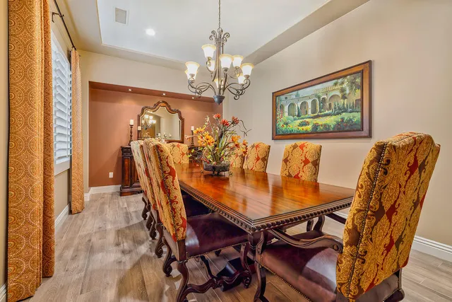 a spacious bedroom with a bed and a flat screen tv