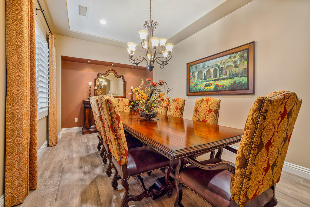 35202 Vista Del Monte Rancho Mirage, CA 92270 - Photo 18 of 35 a view of a dining room with furniture and a chandelier