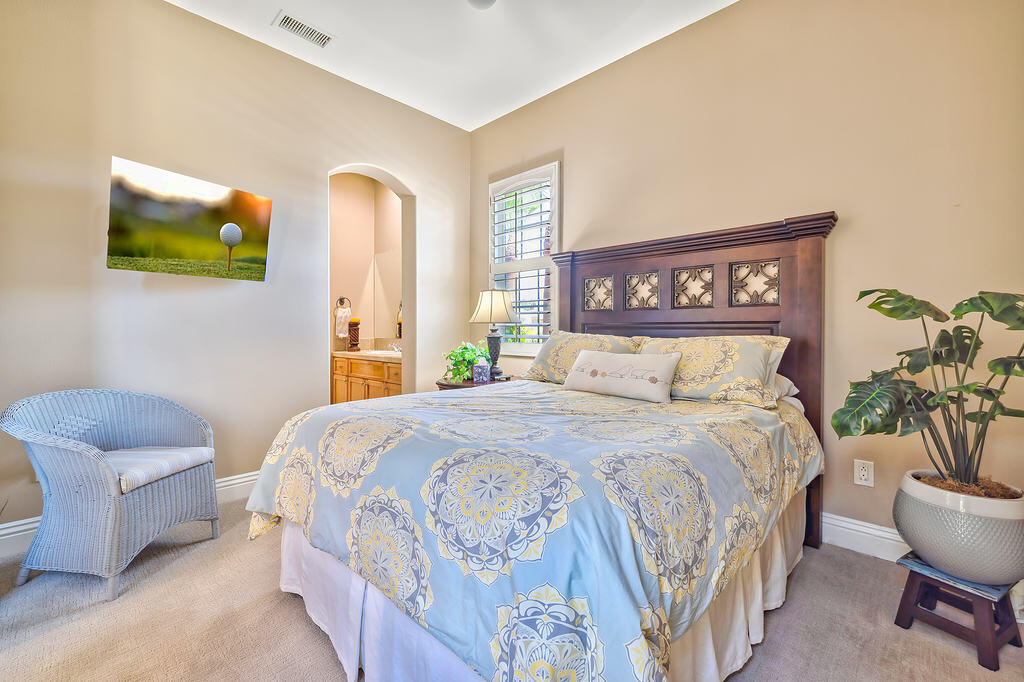 35202 Vista Del Monte Rancho Mirage, CA 92270 - Photo 22 of 35 a bedroom with a bed and window