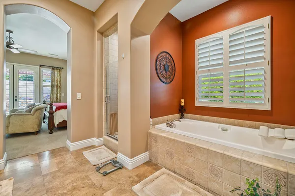 a spacious bathroom with a sink double vanity and a mirror