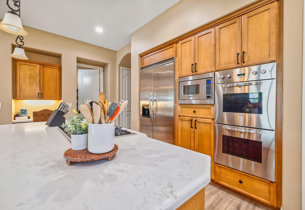 35202 Vista Del Monte Rancho Mirage, CA 92270 - Photo 7 of 35 a kitchen with a refrigerator and a table