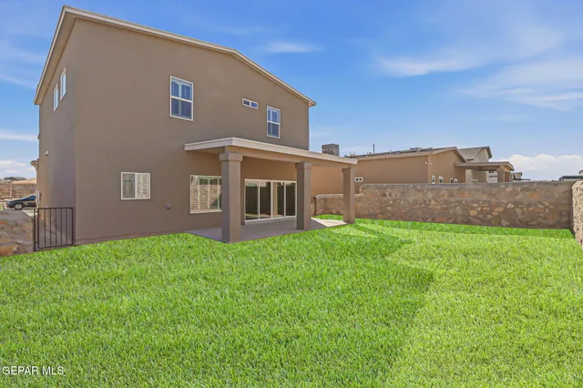 a view of a house with a snow in the background